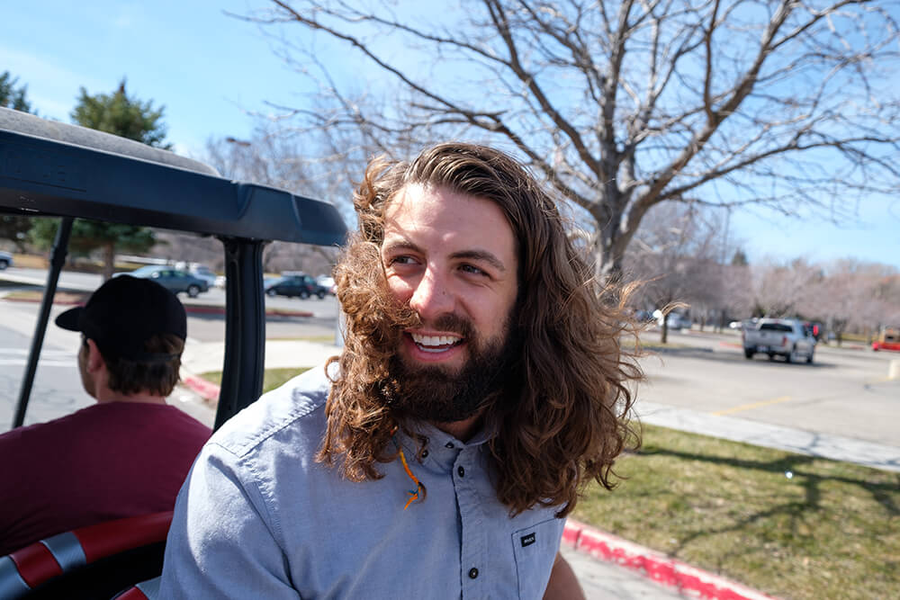 Qualtrics team member on a golf cart