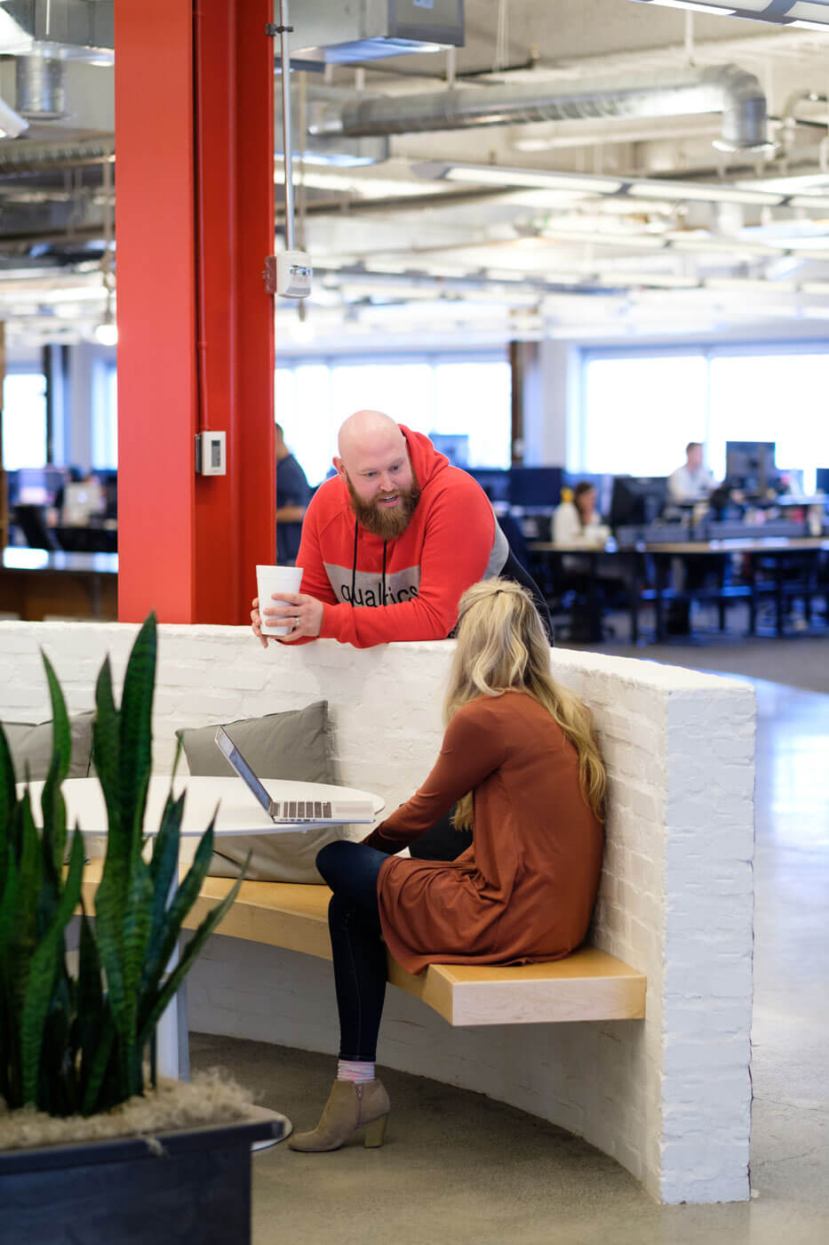 Collegues share ideas in Qualtrics Provo office