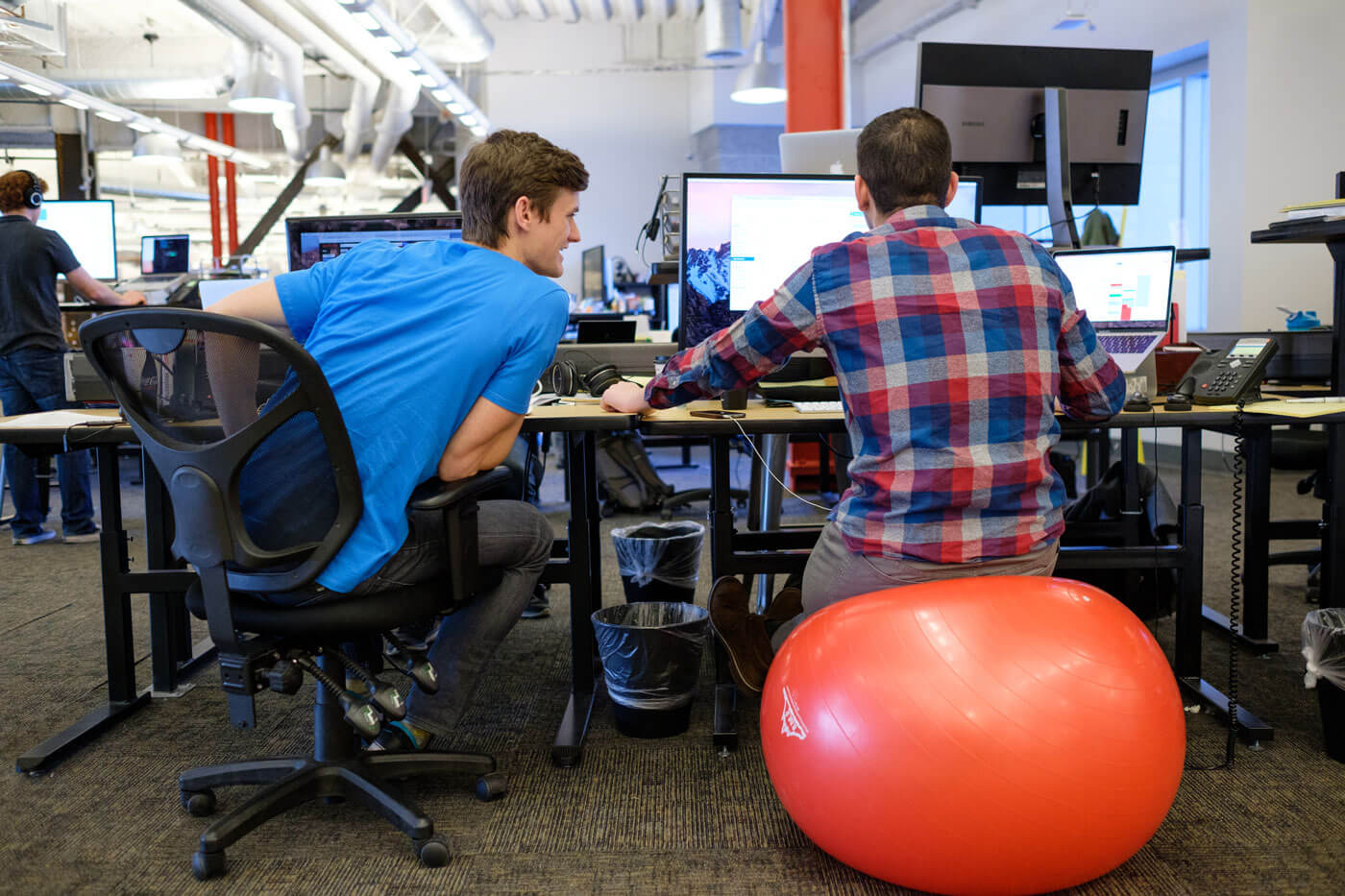 employee on chair and bouncy ball