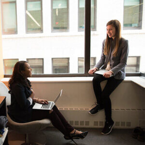 2 female colleagues talking