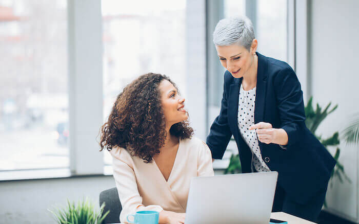 Two women working together