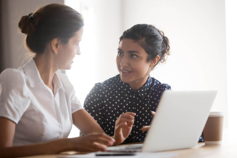 2 employees engaged in meaningful discussion