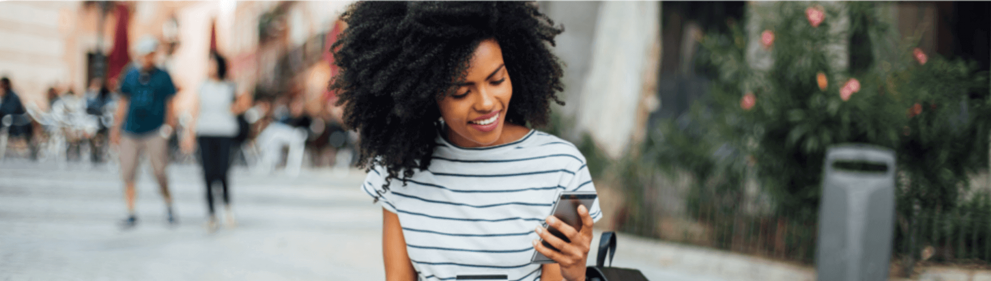 Image of woman looking at phone getting digital support