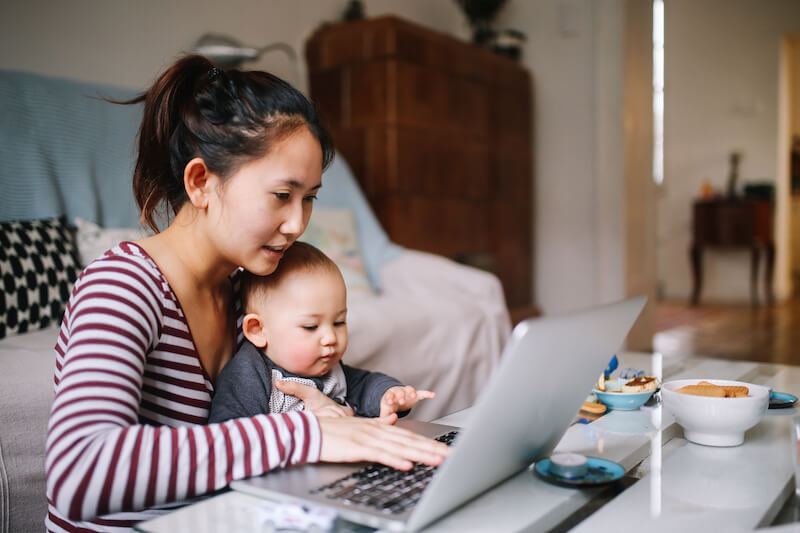 Woman with baby working from home