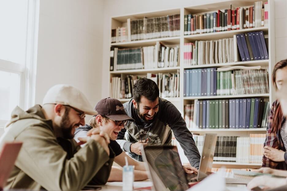 Employees smiling and working together
