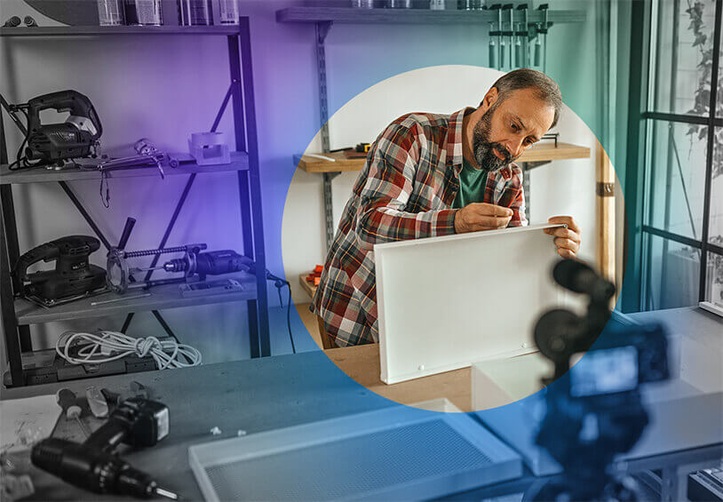 Image of man doing a project in front of a camera