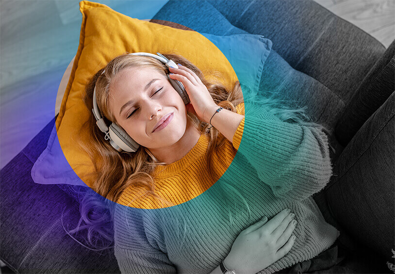 Image of woman listening to music on headphones