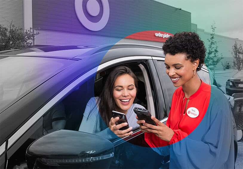 Image of woman interacting with Target employee from her car