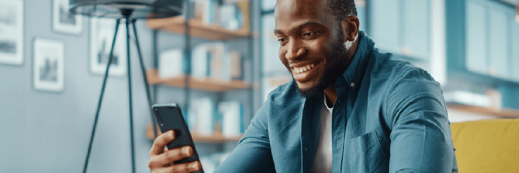 Image of man looking at cell phone