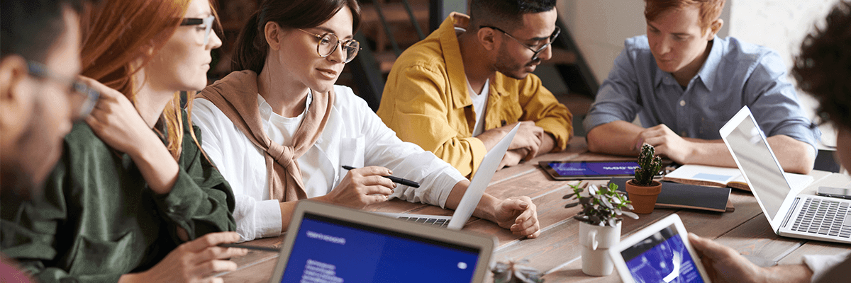A group of employees collaborating together
