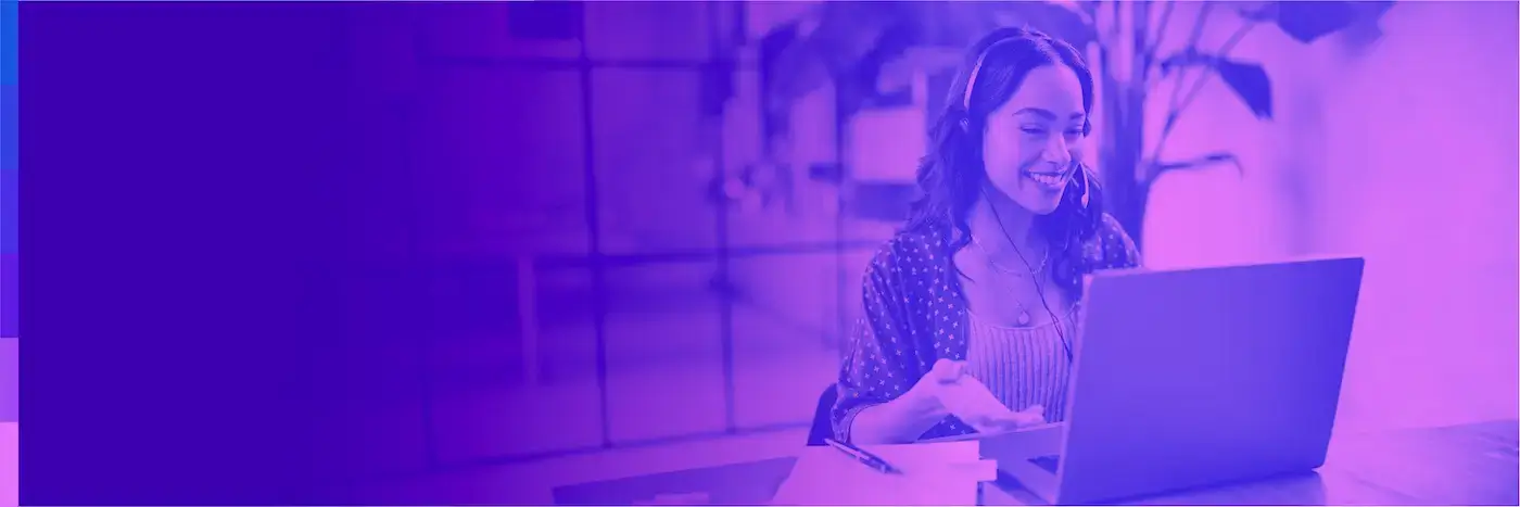 Woman working on her computer and smiling