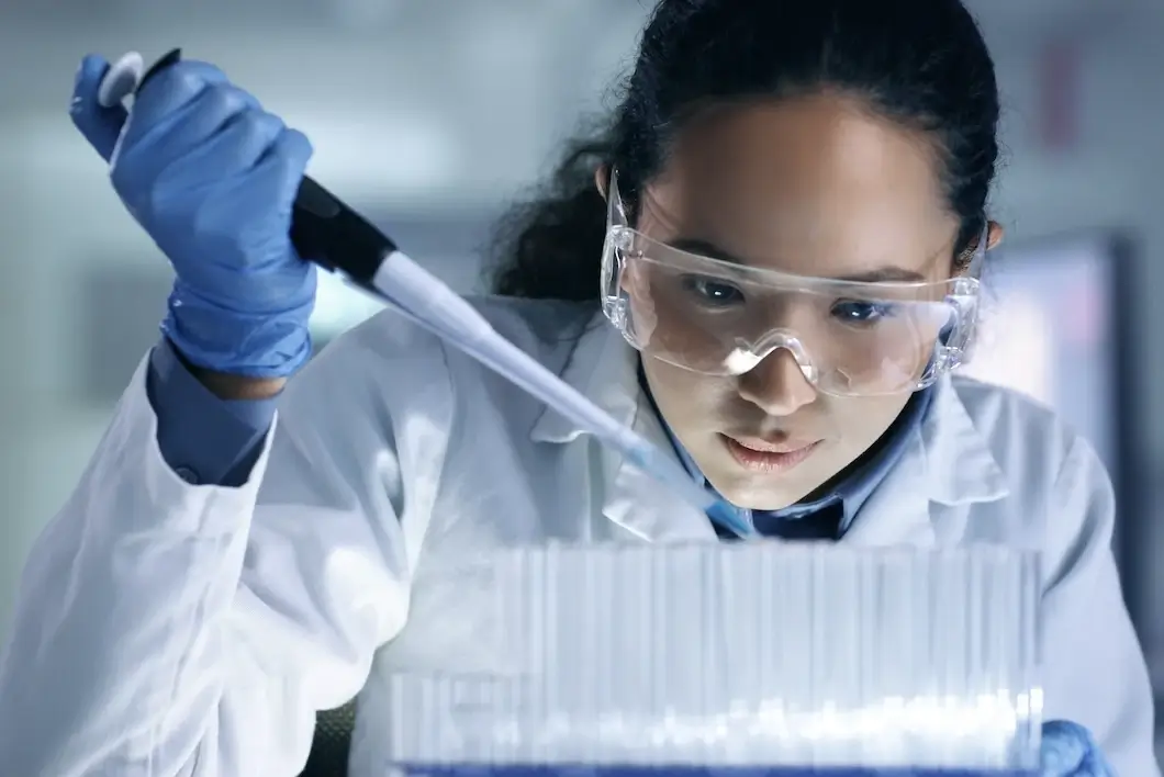 Research, experiment and medical trial being done by a scientist in a lab.