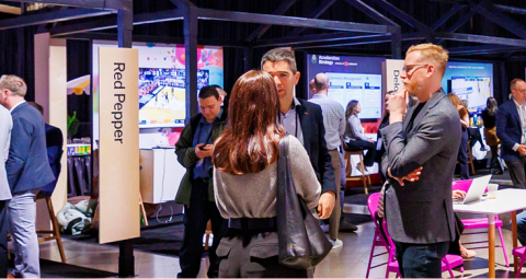 Attendees exploring product demos and immersion labs at X4 Summit