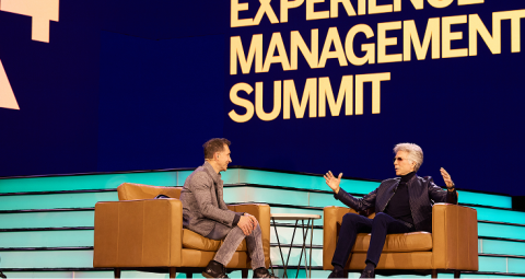 Two speakers in fireside chat conversation on X4 Summit mainstage