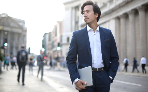 Related Resources Lifestyle Image man in suit walking with device