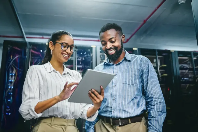 Two smiling employees