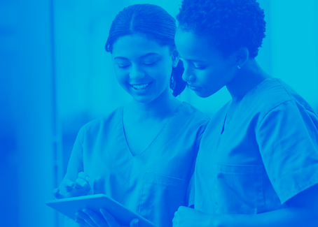 Healthcare employees reviewing charts together