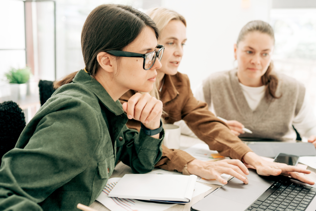 Colleagues are working on a project using computers.