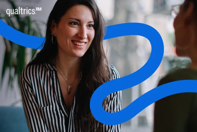 An image of a woman smiling with an stylized blue line illustration across her