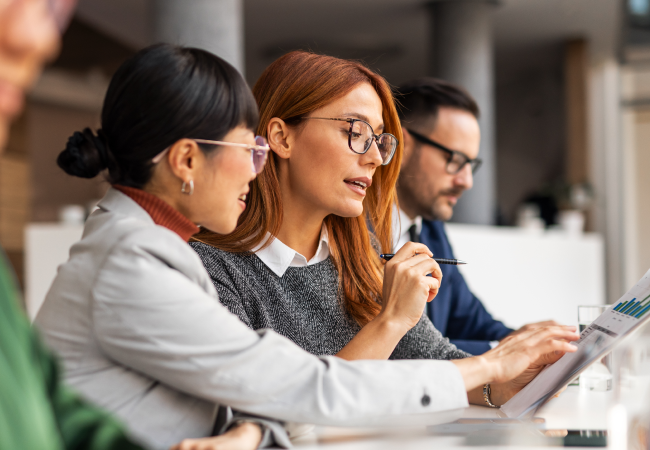 Research professionals examining survey responses.