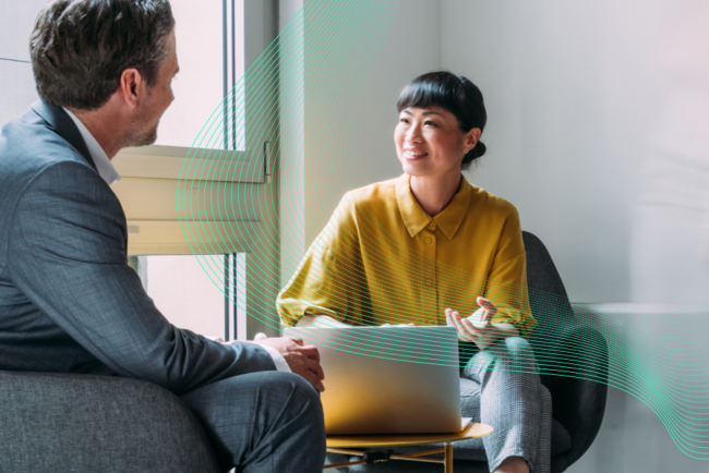 Two people from a government agency discussing AI.