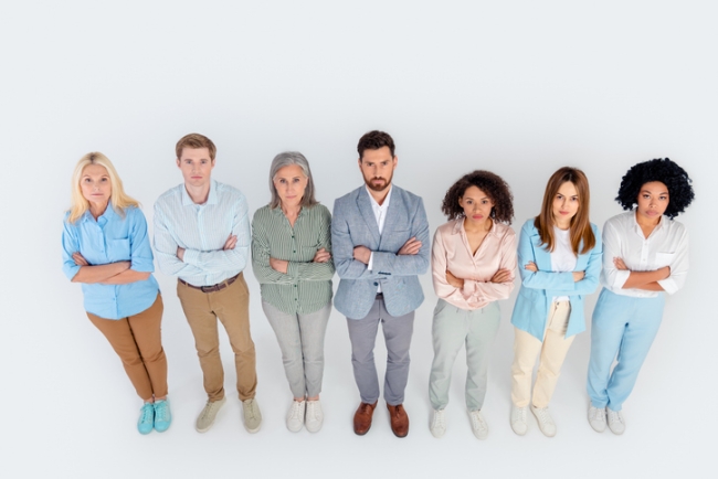 Group of diverse business professionals standing together representing a customer profile.
