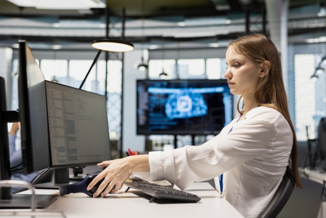 Junior dev speeding up tasks by following AI language model suggestions.