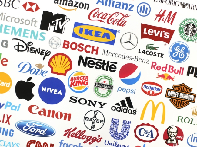Logotype collection of some of most famous brand names in the world on a screen  including Adidas, Nestle, Nike, McDonald's, Sony, Facebook, Ikea, Pepsi.
