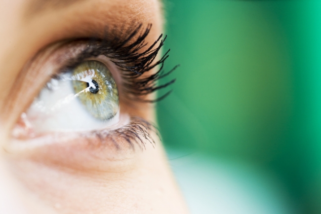 Close up of a woman's green eye.