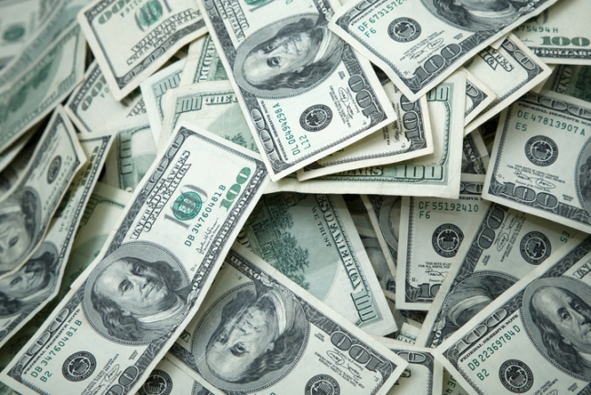 Money pile containing $100 dollar bills.