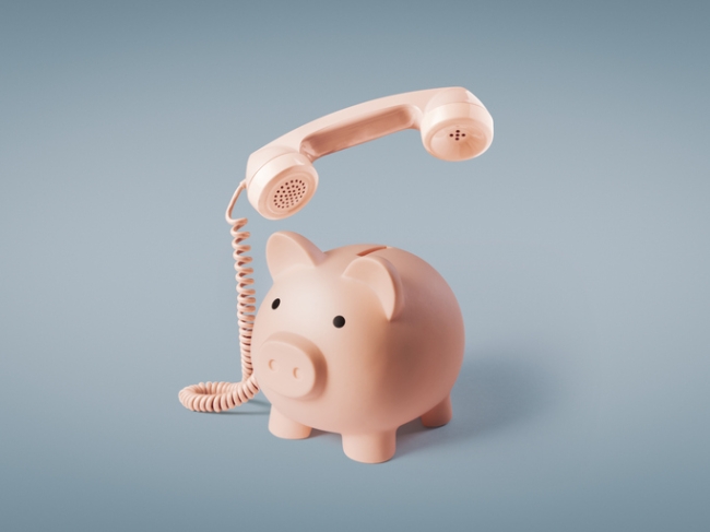Piggy bank telephone: contact center cost concept.