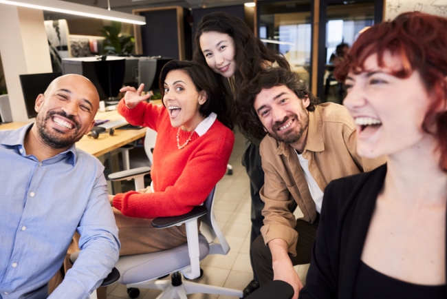 A selfie: the team gathers for a photo at the office.