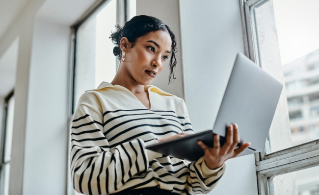 CX professional checking customer feedback through social channels.