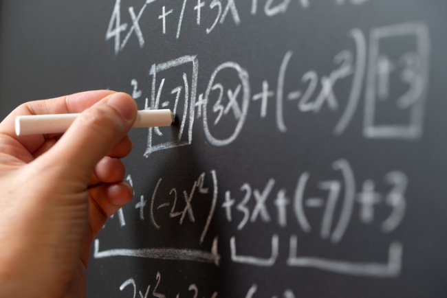 Algebra mathematic formula written on chalkboard.