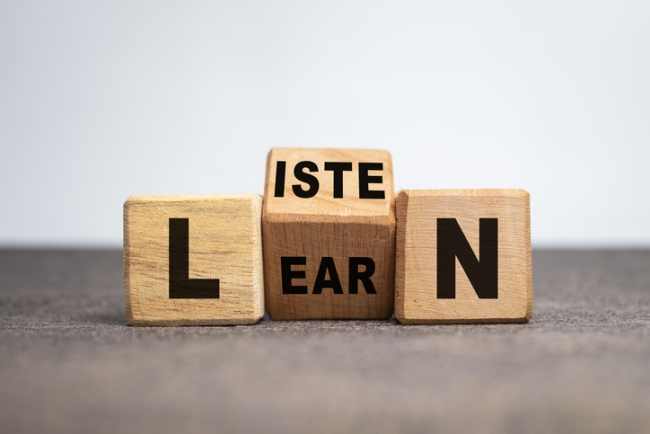 Listen and learn words on turn wooden blocks isolated on white background.