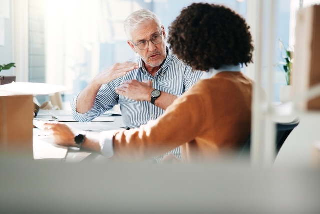 Two business professionals having a conversation.