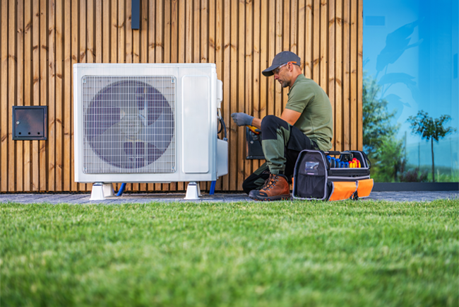 Technician working on an HVAC unit
