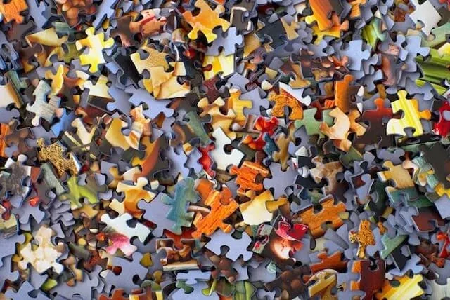 Shuffled pile of puzzle pieces