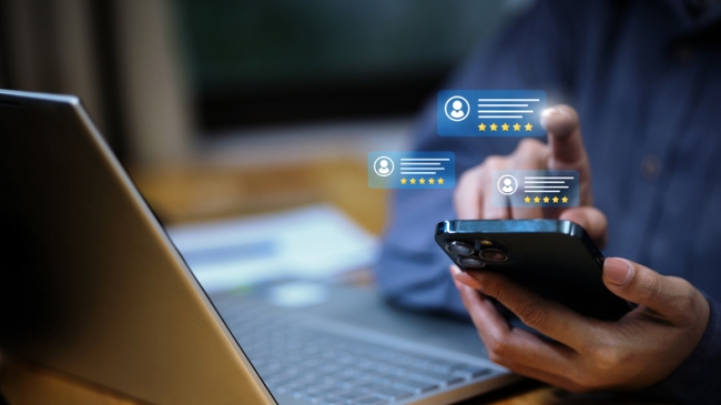 A professional managing online customer reviews and ratings on a smartphone.