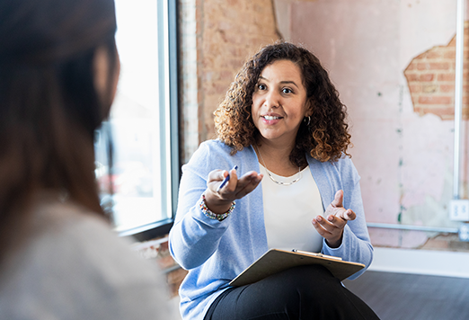 Manager showing empathy in one to one meeting with direct report.