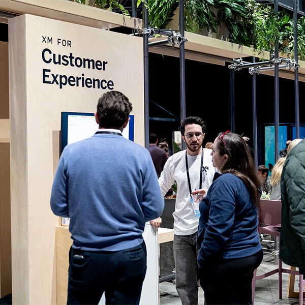 Customers watching a demo at X4