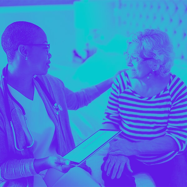 Nurse speaking with a patient