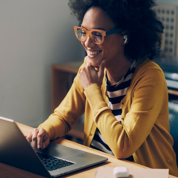 Engaged employee working on a laptop remotely