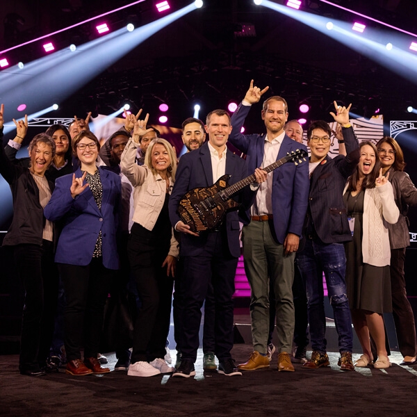 ServiceNow team winning their XM Breakthrough Artist award