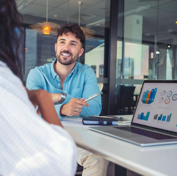 Man using risk management analytics in a meeting