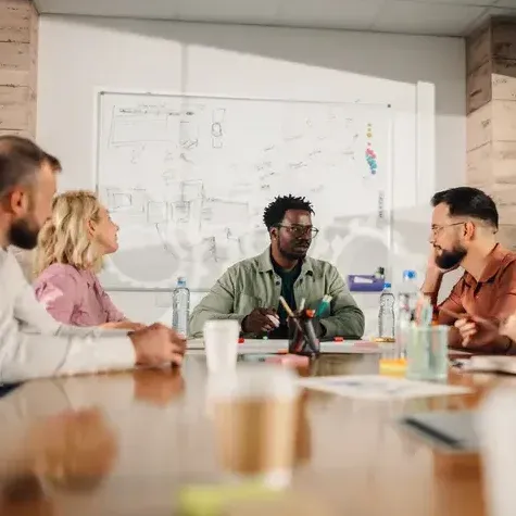 A group of brand researchers sitting around a table