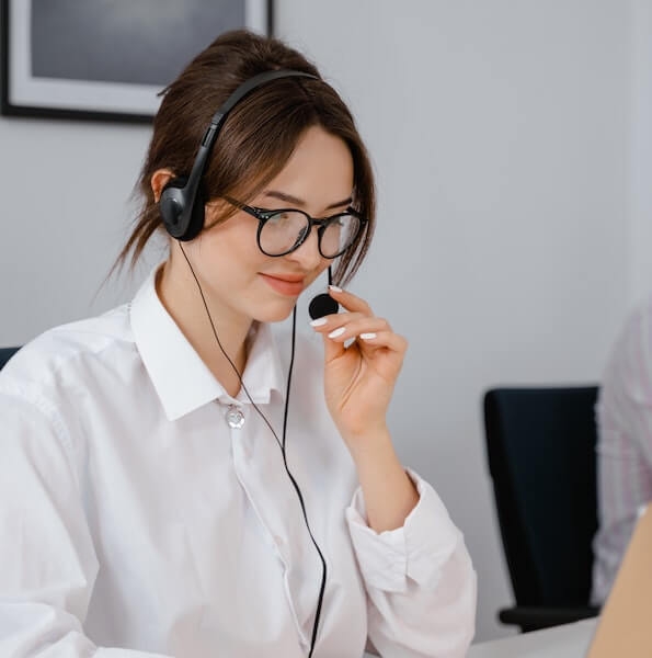 Woman smiling in a call center on the job