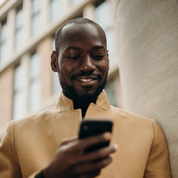 Man smiling while taking a survey