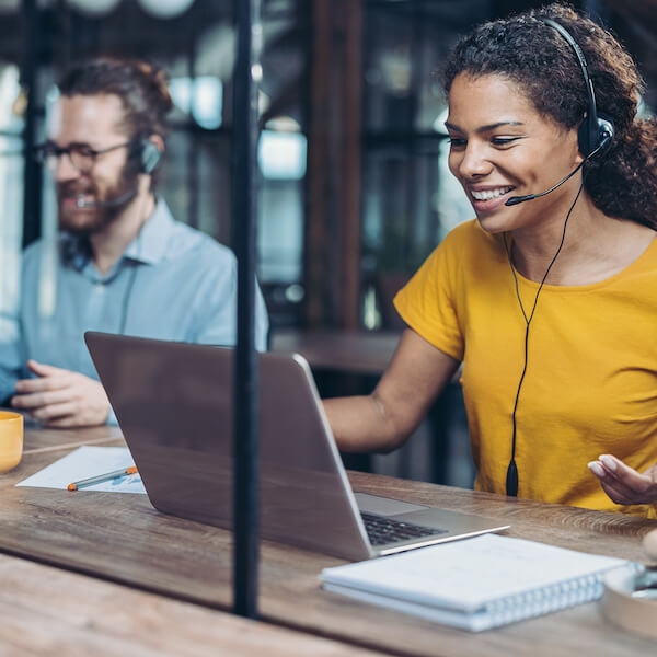 Customer service reps smiling at automation