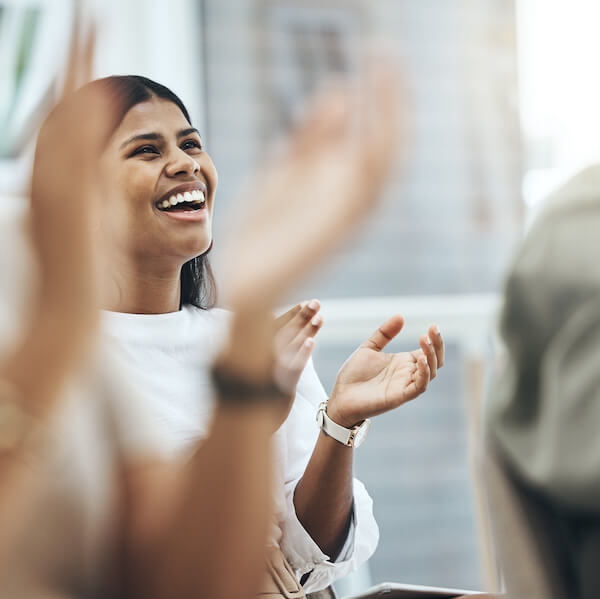 Employees clapping due to the positive work culture